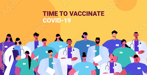 doctors team in uniform standing together medicine healthcare time to vaccinate concept