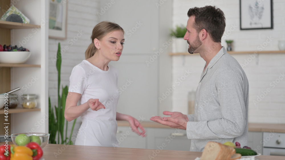 Man Arguing with Woman in Kitchen Man Arguing with Woman in Kitchen