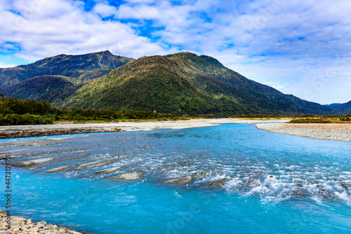 Whataroa River Bend Along State Highway 6 Blue Glacier Water Hill In Background