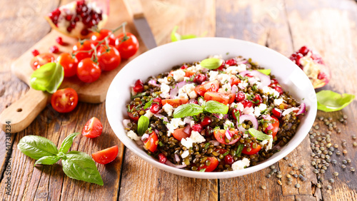 Photography lentil salad with tomato, cheese and pomegranate