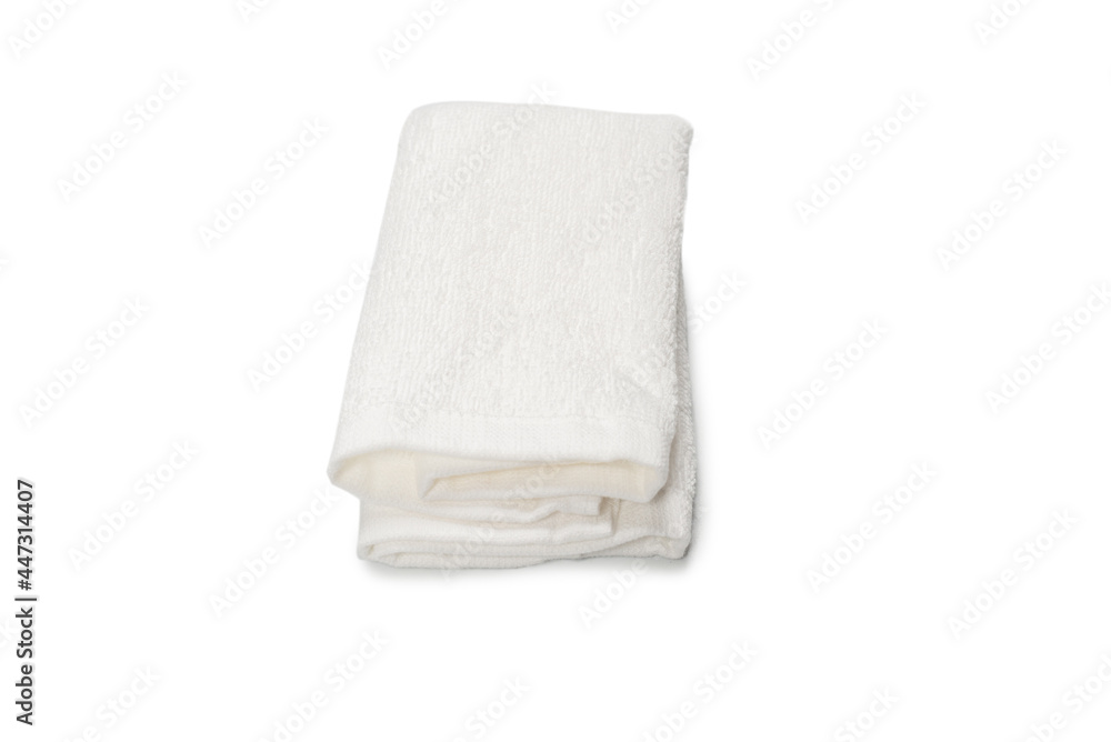 White fluffy cotton towel isolated on a white background.