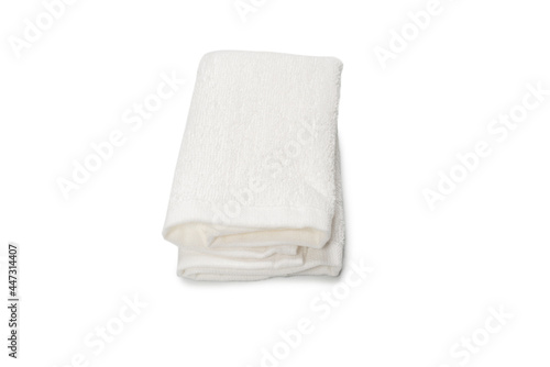 White fluffy cotton towel isolated on a white background.