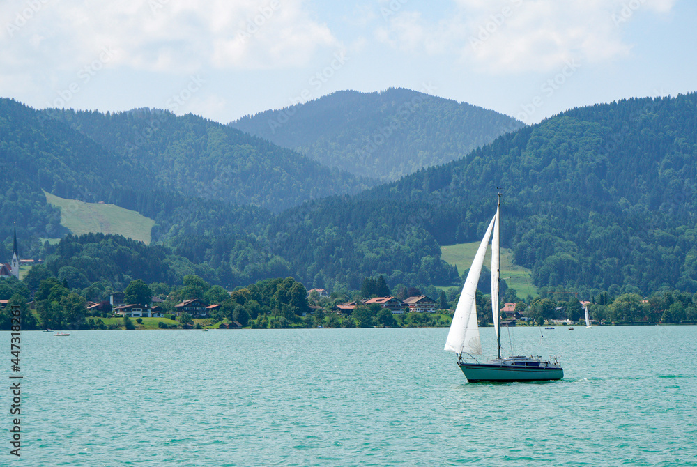 Naklejka premium Landscape shots of the Bavarian Tegernsee lake and its shores with mountains in the background