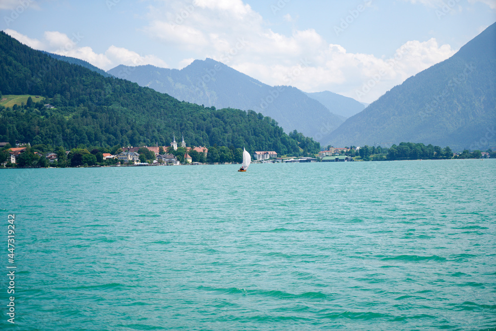 Landscape shots of the Bavarian Tegernsee lake and its shores with mountains in the background