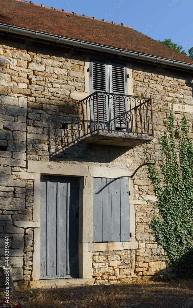 old french house with shutters and balcony