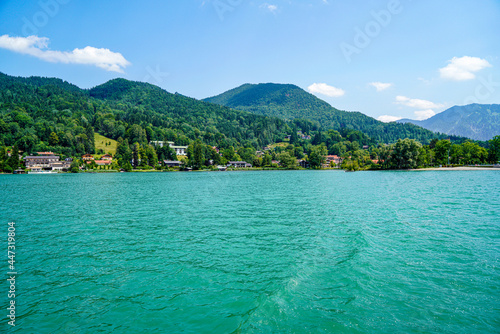 Landscape shots of the Bavarian Tegernsee lake and its shores with mountains in the background photo