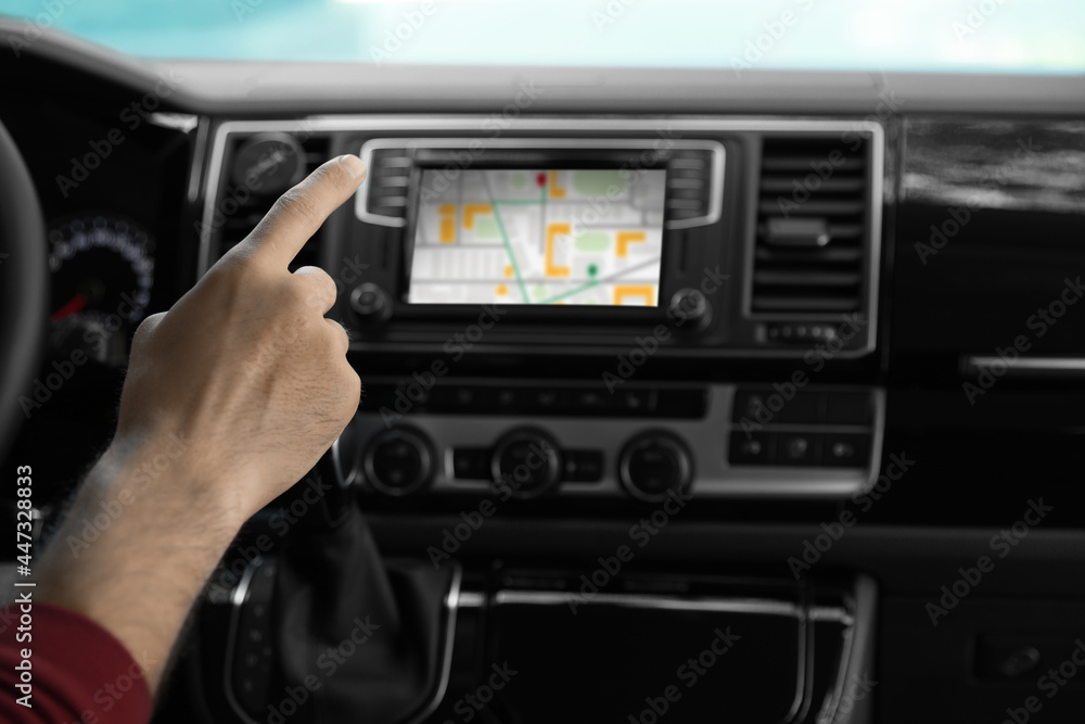 Man using navigation system while driving car, closeup