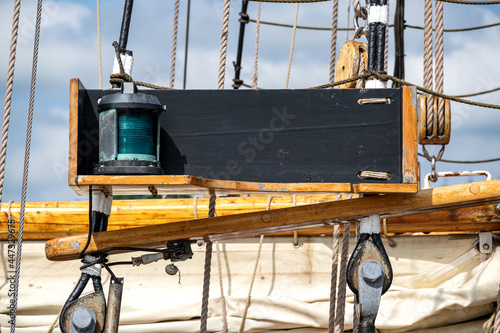 green starboard navigation light aboard a tall ship