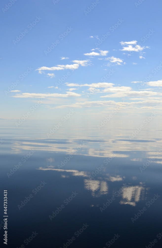 Reflection of clouds in the water of Baikal