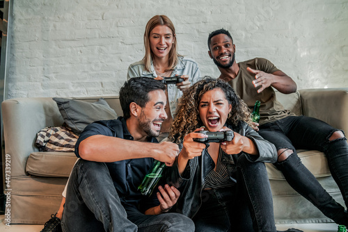 Group of friends playing video games together.