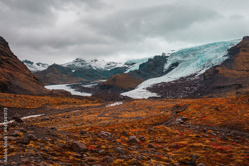 Glacier in an autumn mountain landscape in Iceland