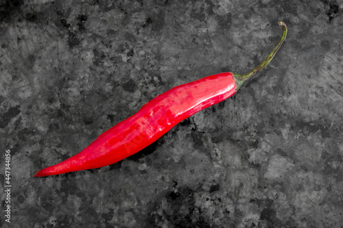 Chili peppers on black granite