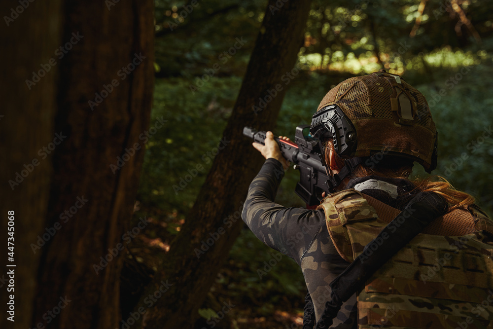 Fototapeta premium Woman in helmet and uniform working soldier