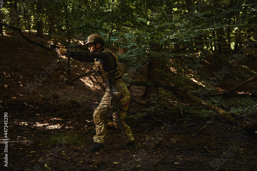 Female person in fighting stance and aiming at target