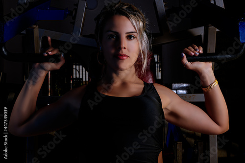 Young beautiful blonde woman training bodybuilding at the gym. © Valter Junior