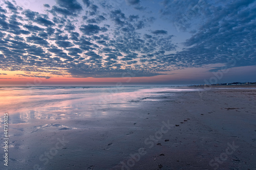 beautiful sunset on a summer evening in the Dutch coastal town of Katwijk aan Zee 