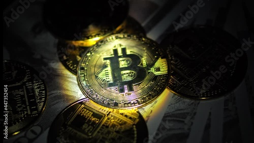 Crypto currency, Bitcoin BTC coin, Blockchain technology, bitcoin mining, Golden bitcoins spin on dollar background, dark background.