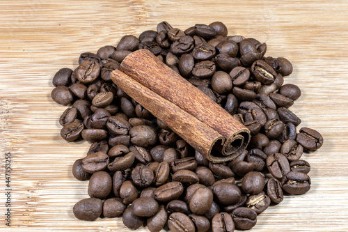 cinnamon sticks on the coffee roasted beans background in Brazil