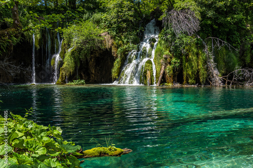 Waterfall with turquoise water in the Plitvice Lakes National Park  Croatia.