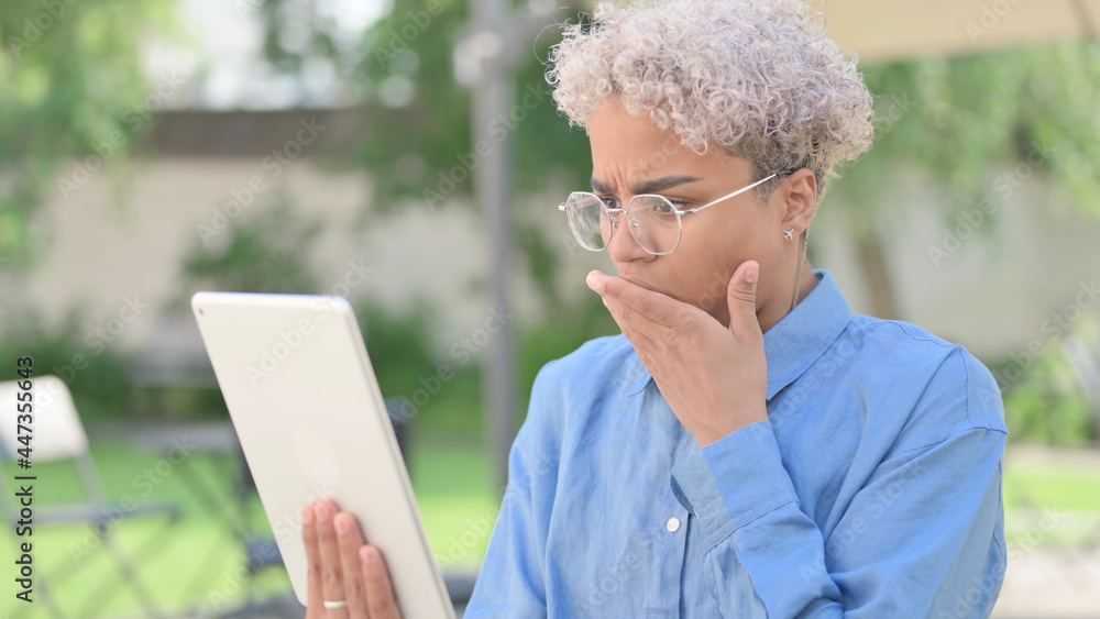 Portrait of African Woman Upset by Loss on Tablet Portrait of African Woman Upset by Loss on Tablet