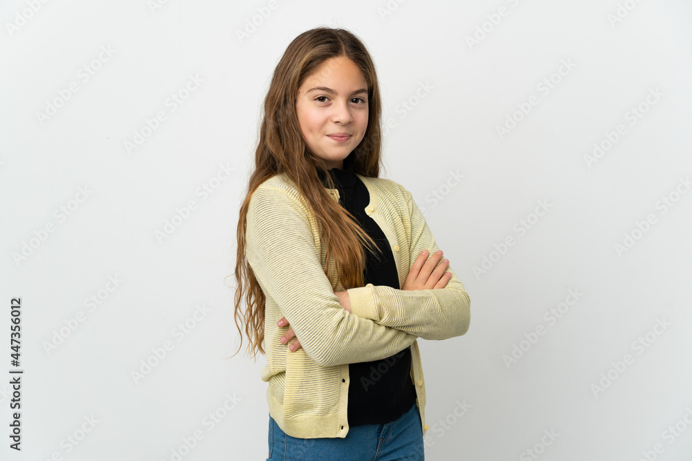Little girl over isolated white background with arms crossed and looking forward Little girl over isolated white background with arms crossed and looking forward