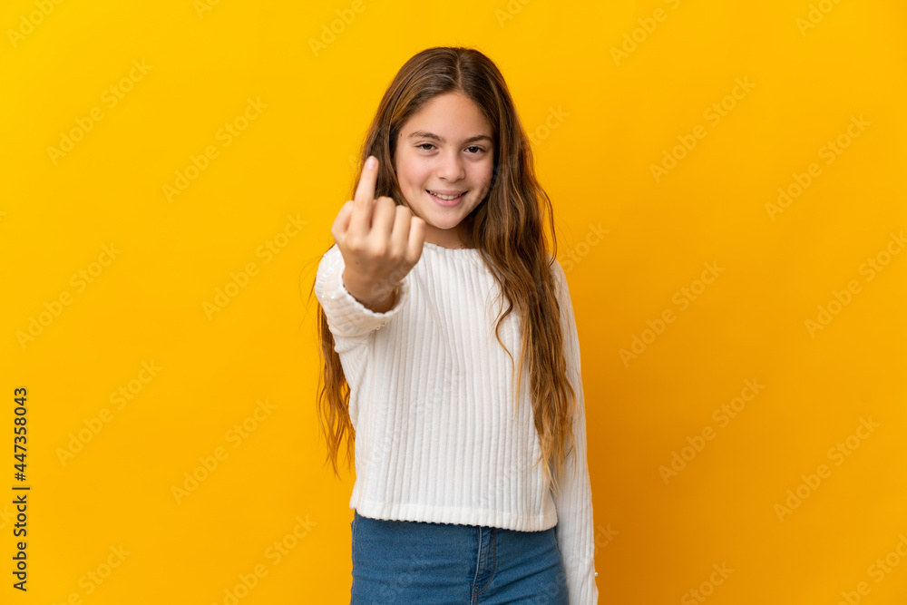 Child over isolated yellow background doing coming gesture Child over isolated yellow background doing coming gesture