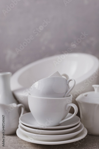Empty crockery set or white ceramic dishes. White kitchen dishware and tableware on table