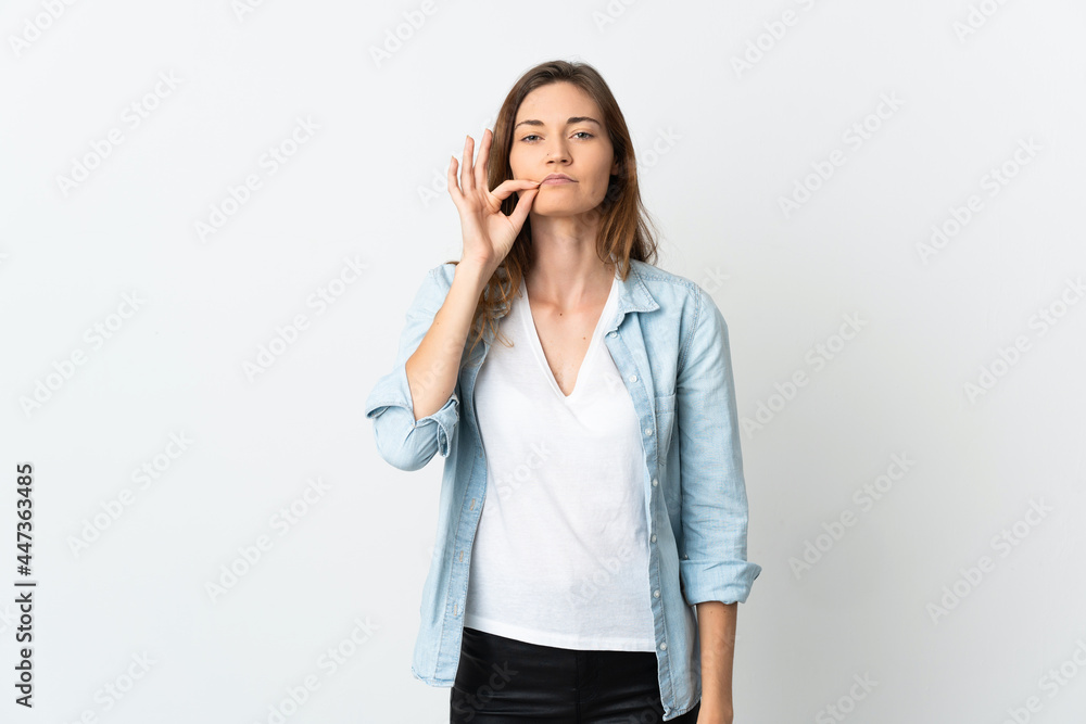 Young Ireland woman isolated on white background showing a sign of silence gesture Young Ireland woman isolated on white background showing a sign of silence gesture