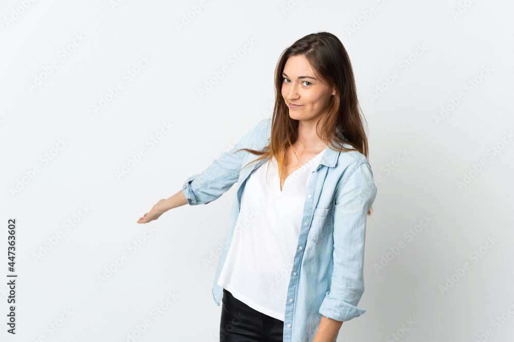 Young Ireland woman isolated on white background extending hands to the side for inviting to come Young Ireland woman isolated on white background extending hands to the side for inviting to come