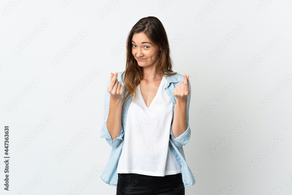 Young Ireland woman isolated on white background making money gesture Young Ireland woman isolated on white background making money gesture