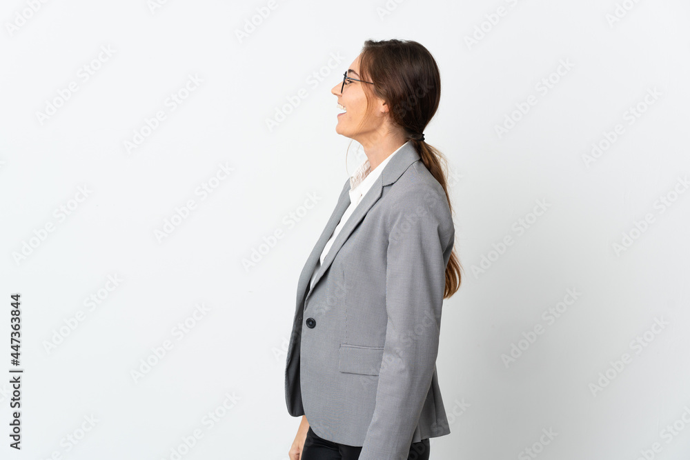 Business Ireland woman isolated on white background laughing in lateral position Business Ireland woman isolated on white background laughing in lateral position