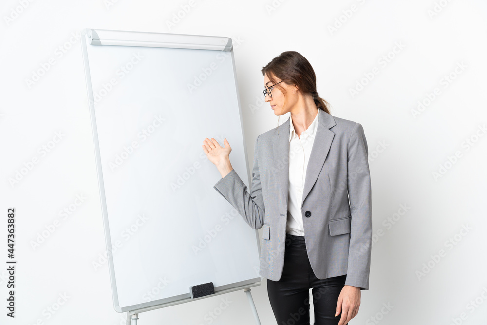 Young Ireland woman isolated on white background giving a presentation on white board Young Ireland woman isolated on white background giving a presentation on white board