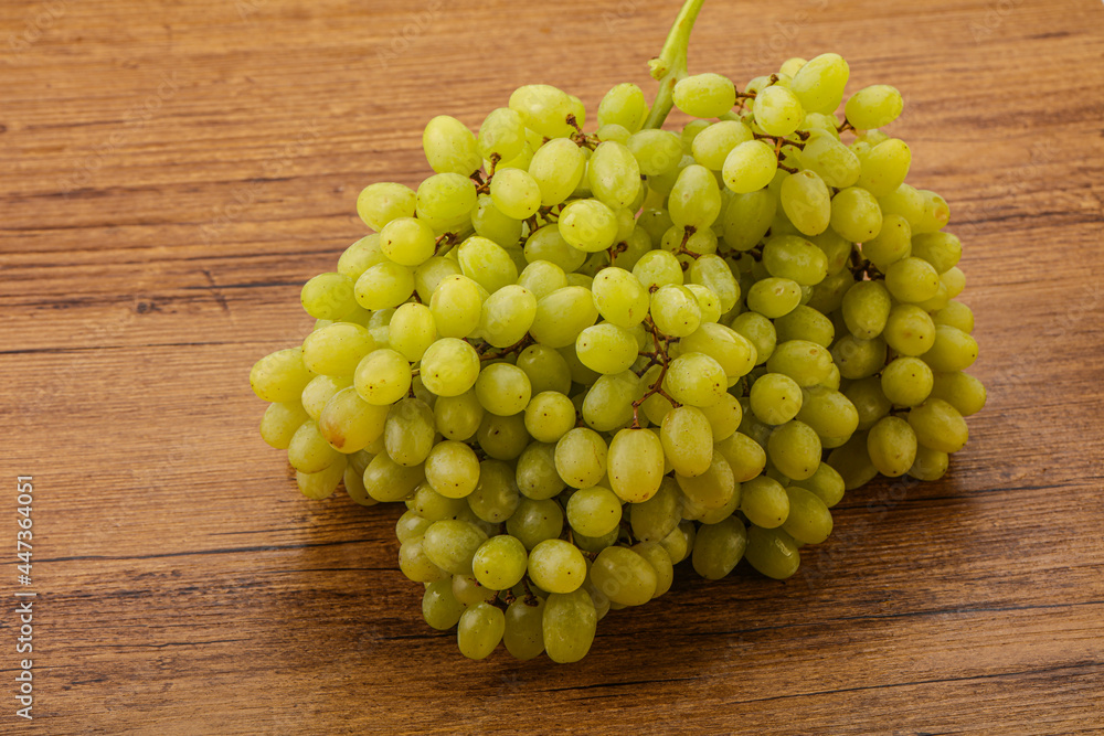 Green grape branch over background Green grape branch over background