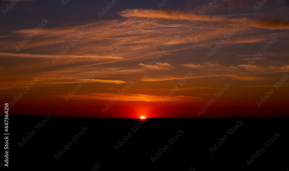 sunset On the horizon of a hill