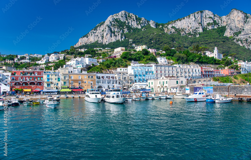 CAPRI, ITALY - JUNE 18, 2021: Famous port of Capri on a sunny beautiful day.