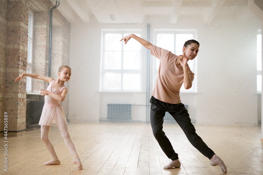 Little girl dancing with mentor