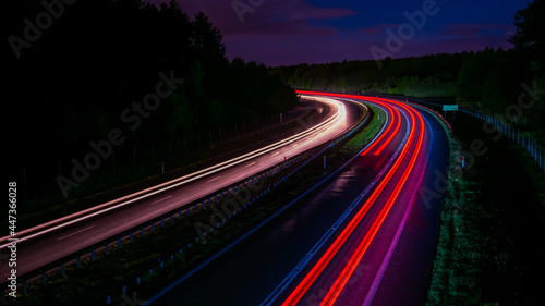 Night road lights. Lights of moving cars at night. long exposure