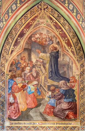 VIENNA, AUSTIRA - JUNI 17, 2021: The fresco St. Dominic presented the Rosary in the Votivkirche church by brothers Carl and Franz Jobst (sc. half of 19. cent.). © Renáta Sedmáková