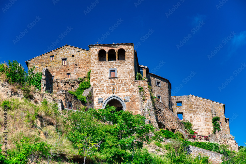 Civita di Bagnoregio, Italy. Summer view of beautiful medieval streets and buildings.