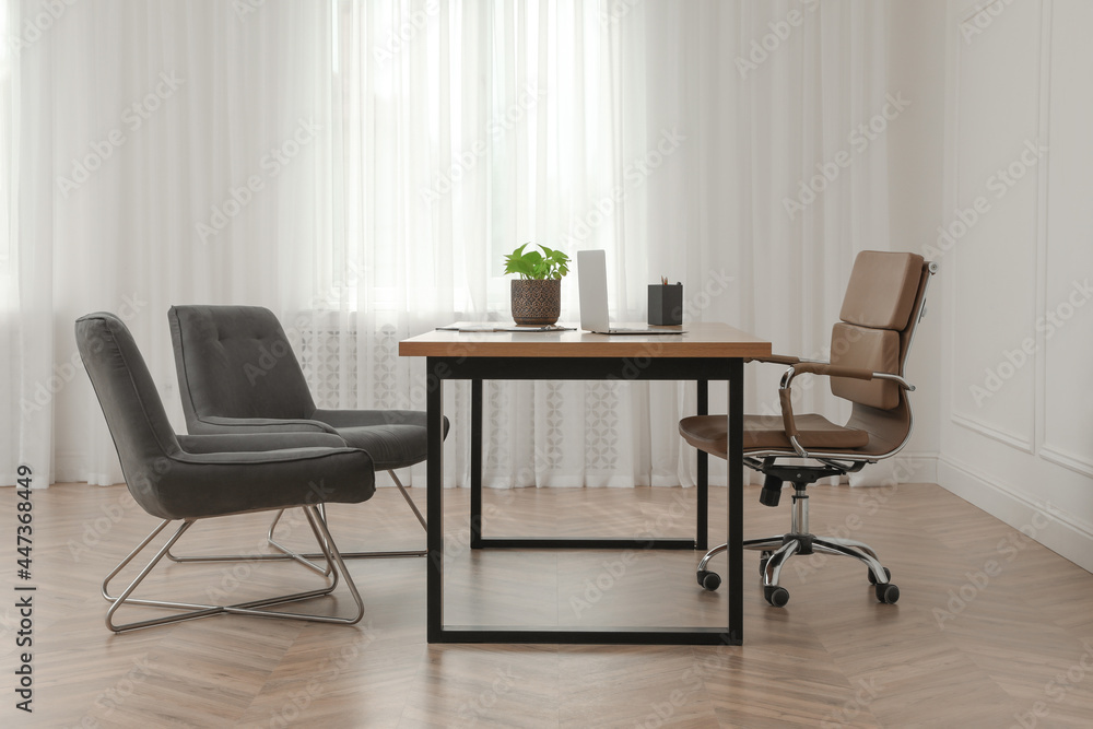Director's office with large wooden table and comfortable armchairs. Interior design Director's office with large wooden table and comfortable armchairs. Interior design