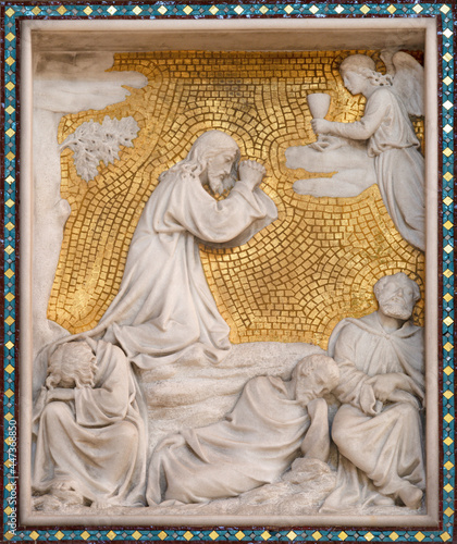 VIENNA, AUSTIRA - JUNI 24, 2021: The relief of Jesus prayer in the Gethsemane garden on the sidealtar of Votivkirche cathedral from 19. cent. photo