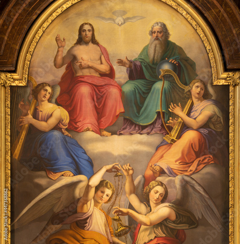 VIENNA, AUSTIRA - JUNI 17, 2021: The detail of Holy Trinity painting on the main alatr of baroque church Alserkirche by Joseph Ritter von Hempel (1826).
