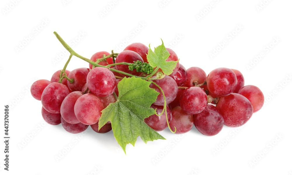 Fototapeta premium Cluster of ripe red grapes with green leaves on white background