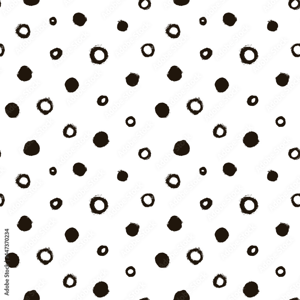 Seamless pattern with black circles scattered on white background. Hand drawn polka dot vector ornament. Modern abstract design for print or textile. Different grunge effect rounded spots and circles Seamless pattern with black circles scattered on white background. Hand drawn polka dot vector ornament. Modern abstract design for print or textile. Different grunge effect rounded spots and circles