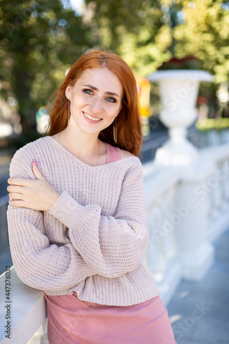 portrait of a young woman with red hair. walk in the park © Svetlana