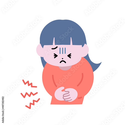 腹痛で苦しそうにお腹を押さえている女の子