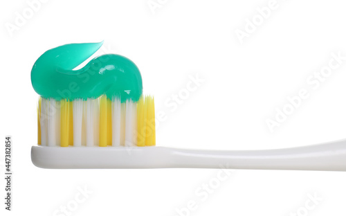 Plastic brush with toothpaste isolated on white  closeup