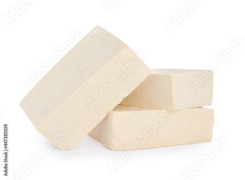 Blocks of delicious raw tofu on white background