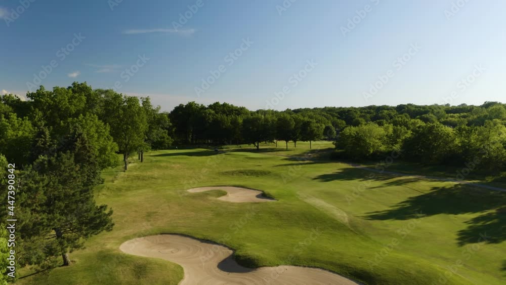 Amazing Aerial View of Golf Course on Summer Day. Drone Pedestal Up Reveal Trees Amazing Aerial View of Golf Course on Summer Day. Drone Pedestal Up Reveal Trees