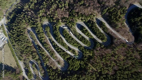 Vehicles Driving At The Hairpin Turn Road Of Bratocea Pass In Romania. aerial photo